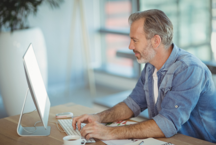 Man Sitting at Desk Working